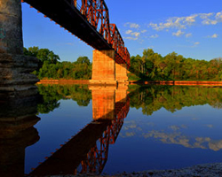 Over the Red River Carperter's Buff Bridge  by Randall Watkins